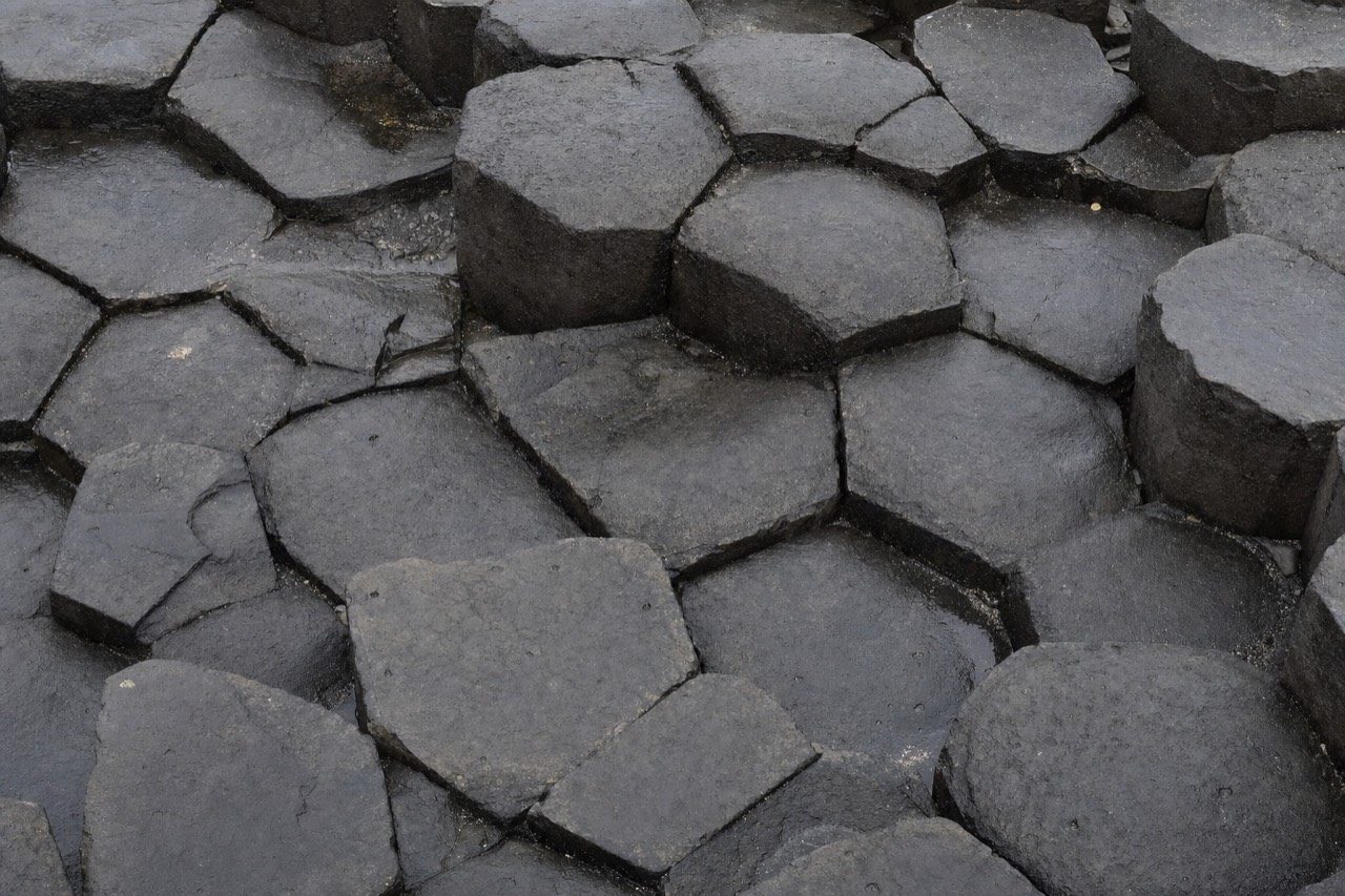 Close-up of hexagonal basalt column tops at Reynisfjara