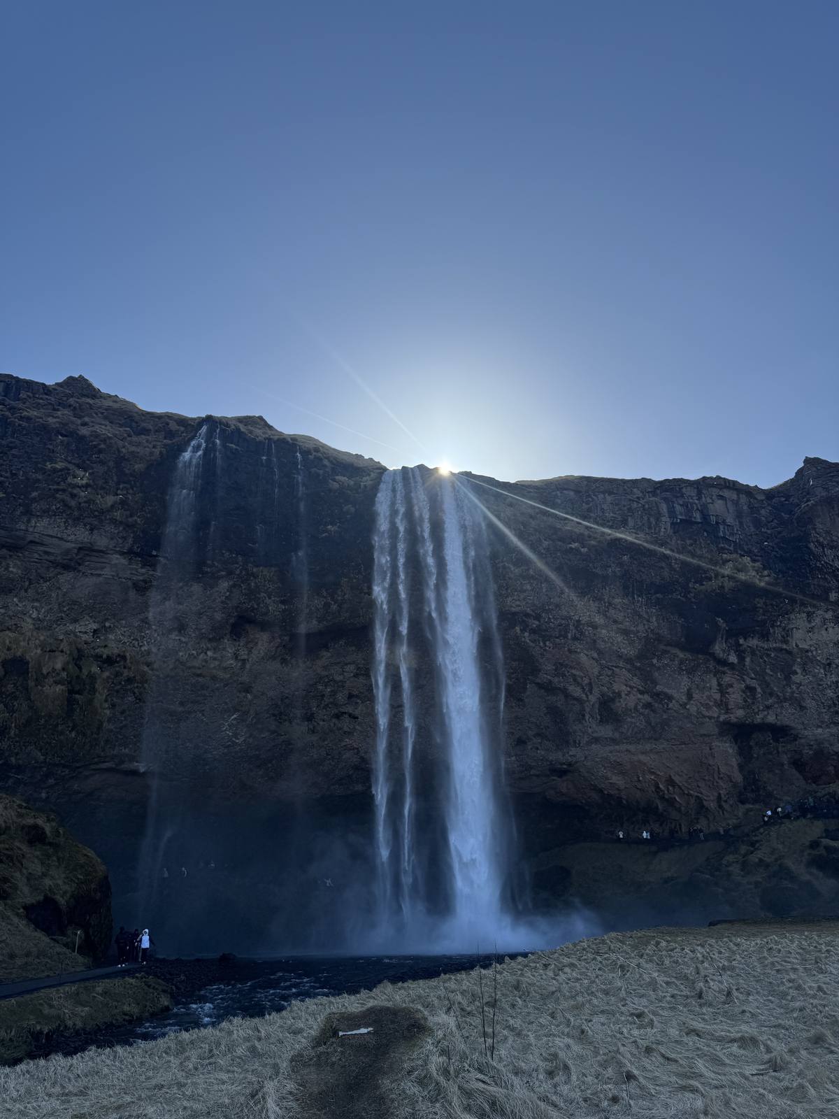 Seljalandsfoss waterfall on Iceland's South Coast with the path leading behind the falling water